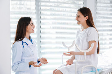 Female gynecologist working with patient in clinic