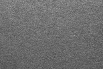 Gray felt texture abstract art background. Colored fabric fibers surface. Empty space.