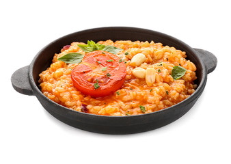 Frying pan with tasty risotto on white background