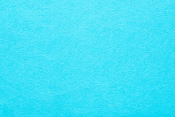 Sky blue felt texture abstract art background. Colored fabric fibers surface. Empty space.