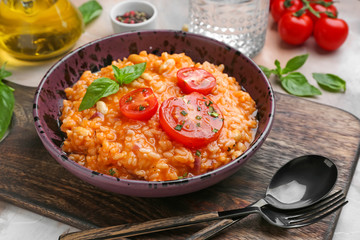 Plate with tasty risotto on table