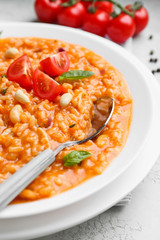 Plate with tasty risotto on table, closeup