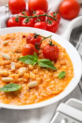 Plate with tasty risotto on table