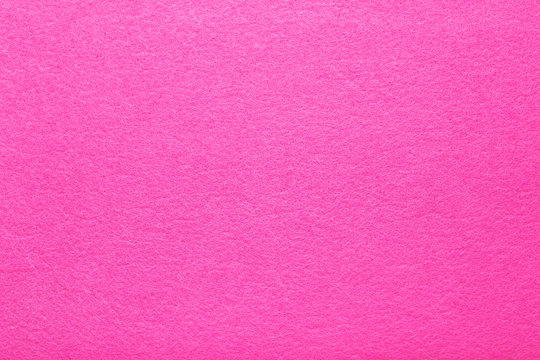 Hot pink felt texture abstract art background. Colored fabric fibers surface. Empty space.