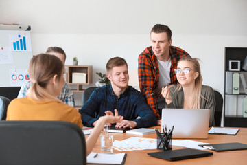 Group of young people at business meeting in office