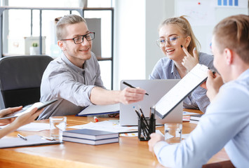 Group of young people at business meeting in office