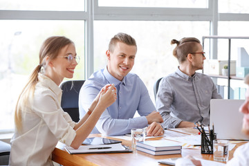 Group of young people at business meeting in office