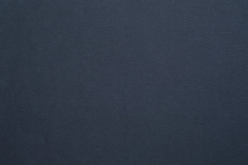 Dark gray felt texture abstract art background. Colored carton surface. Copy space.