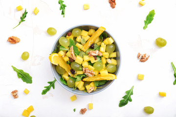 Bowl with tasty mango salad on white background