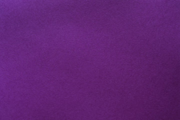 Purple felt texture abstract art background. Solid color wool textile. Empty space.