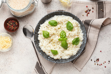 Plate with tasty risotto on table