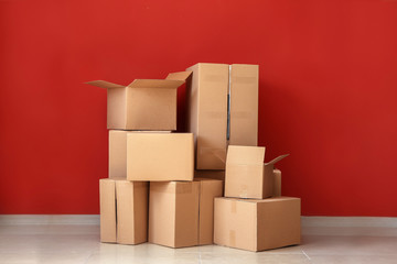 Cardboard boxes near color wall