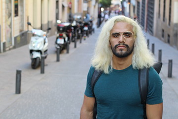 Ethnic man with blonde dyed long hairstyle