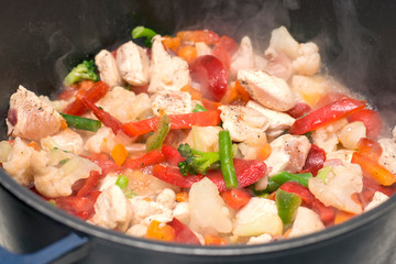 Cooking fresh vegetables in a pan