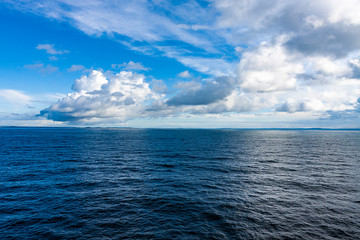LANDSCAPE OF SEA AND HORIZON OF HEAVEN AND WHITE CLOUDS IN THE SEA OF THE NORTH