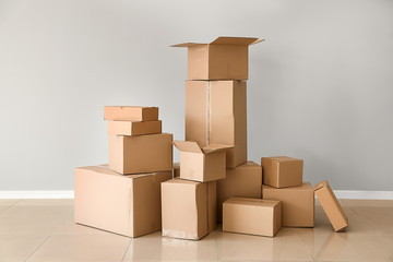 Cardboard boxes near light wall