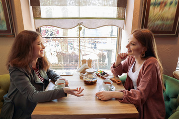 Beautiful young women resting in cafe