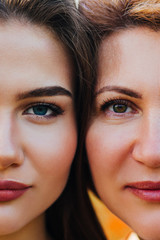 Similar portraits of a mother and daughter. 