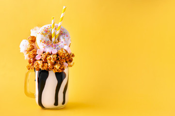 Delicious freak shake on color background