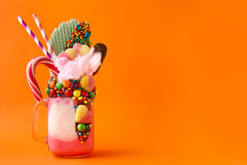 Delicious freak shake on color background