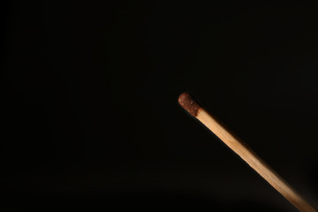 Match on black background