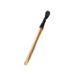 Burnt out match on white background