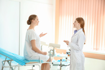 Young woman visiting her gynecologist in clinic - obrazy, fototapety, plakaty