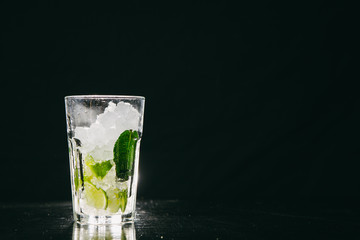 Mojito cocktail stands on a bar counter
