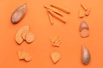 Fresh sweet potatoes on color background