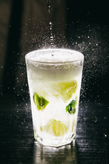Close-up of Mojito cocktail stands on a bar counter
