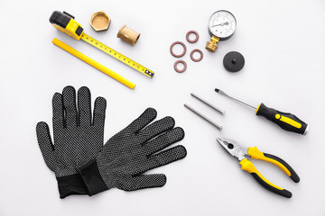 Set of plumber tools on white background