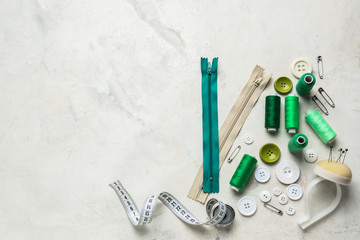 Set of sewing threads and accessories on light background