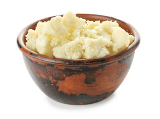 Bowl with shea butter on white background