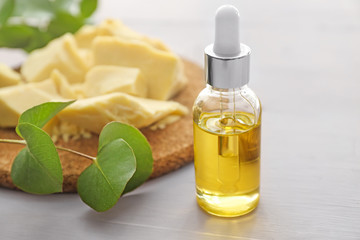 Cocoa essential oil and butter on table