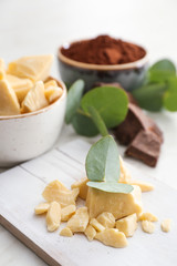 Pieces of cocoa butter on table