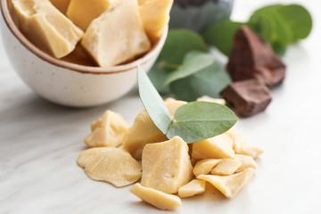 Pieces of cocoa butter on table