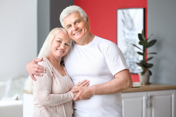 Portrait of happy mature couple at home