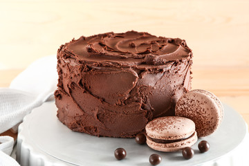 Tasty chocolate cake on stand