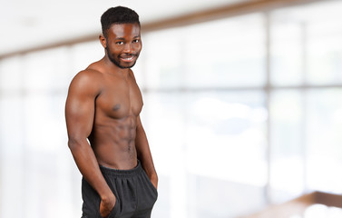 Fototapeta na wymiar Enjoying healthy lifestyle. Young muscular African man