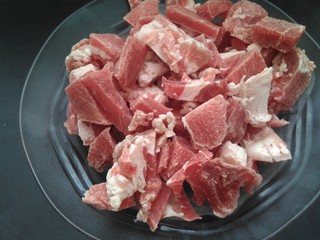 chopped red meat pieces. frozen.