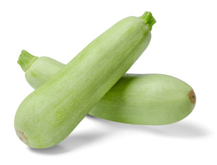 Two fresh zucchini on a white isolated background. Close-up. Side view.
