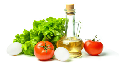 Salad, eggs, tomatoes and vegetable oil. White isolated background. Bright saturated colors.