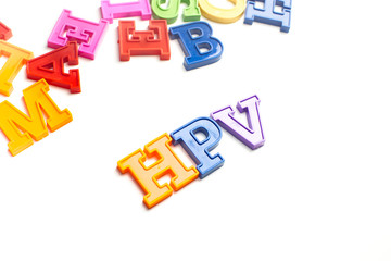 Obraz premium Heap of plastic colored alphabet letters close up. HPV