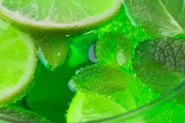 mint and lime in cocktail close-up