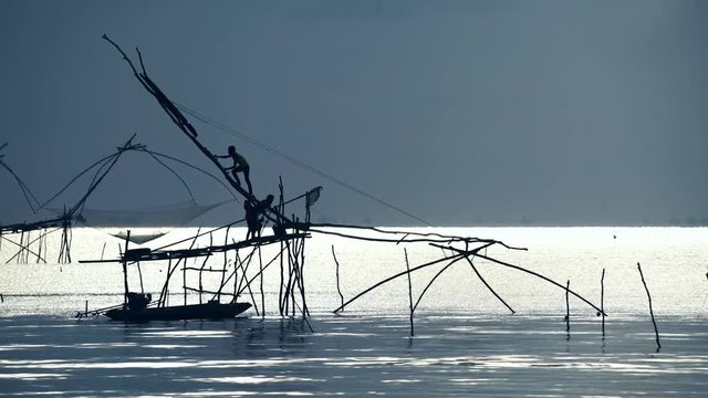 Yokyor is old style for fishing of Thai people in Pak Pra Village, sunrise time in Phatthalung, Thailand..