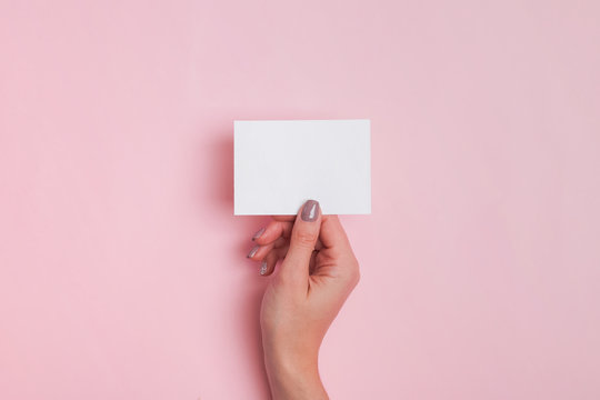 Woman's Hand Holding Blank Paper Card