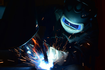 Industrial steel welder in factory welder, craftsman