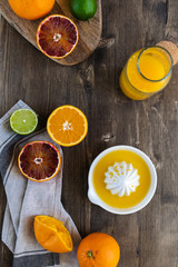 Fresh juicy oranges halved,limes, grapefruits, fresh squeezed orange juice