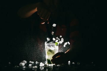 Barman making Mojito and spalshing it out