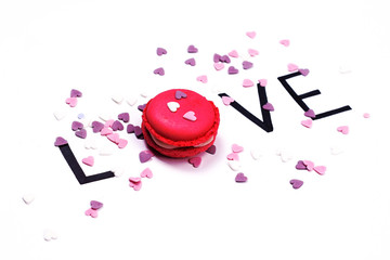 Valentin's day and holiday background.  Love. Pink macaroon and hand drawn letters with little...
